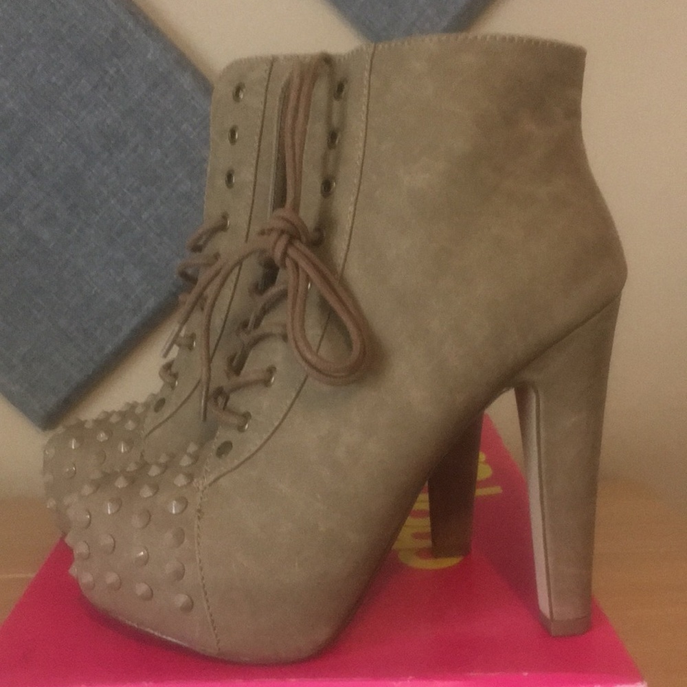 Spike toe high heeled lace up booties
